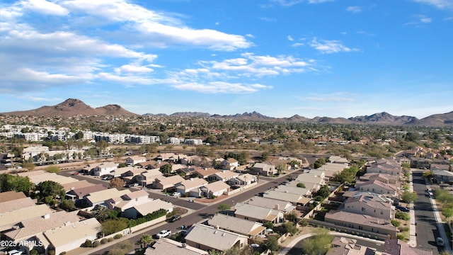 birds eye view of property with a mountain view and a residential view