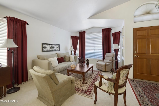 living room with lofted ceiling and light carpet