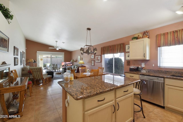 kitchen featuring plenty of natural light, open floor plan, and stainless steel dishwasher