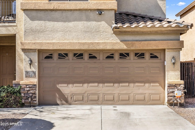 garage featuring driveway