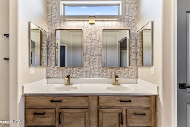 full bath with double vanity and a sink