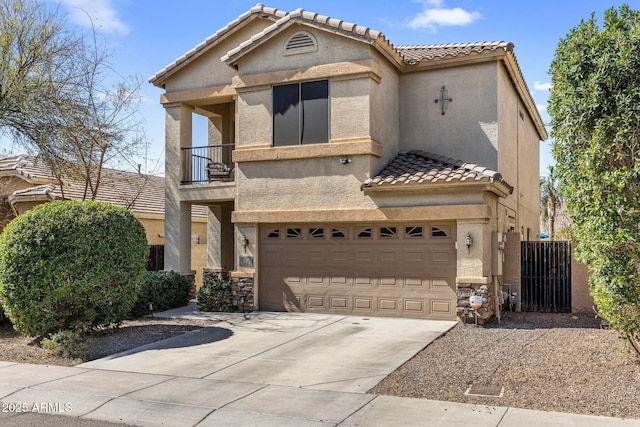 mediterranean / spanish-style house with a garage, concrete driveway, a balcony, stone siding, and stucco siding