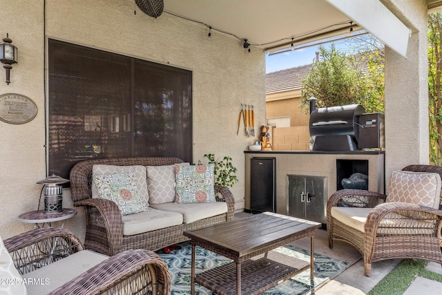 view of patio with outdoor lounge area and area for grilling