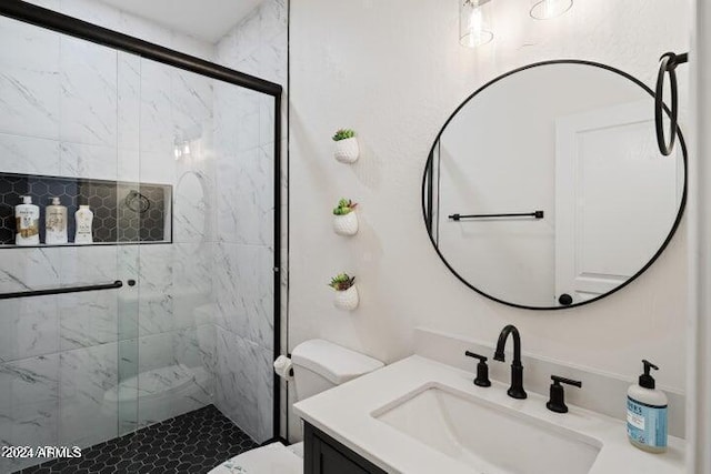 full bath featuring a shower stall, toilet, and vanity