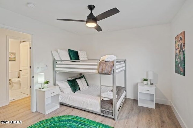 bedroom featuring ceiling fan, baseboards, and wood finished floors