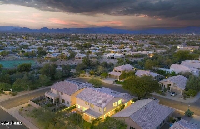 aerial view at dusk with a mountain view