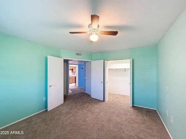 1553 E Flower Cir, Mesa, AZ 85204 - unfurnished bedroom featuring carpet, a closet, and a ceiling fan