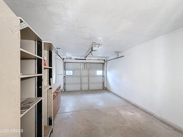 1553 E Flower Cir, Mesa, AZ 85204 - garage with a garage door opener and baseboards