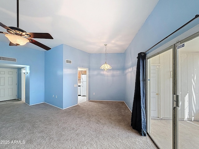 1553 E Flower Cir, Mesa, AZ 85204 - unfurnished living room with ceiling fan, carpet, a chandelier, and baseboards