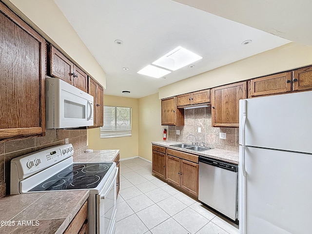 1553 E Flower Cir, Mesa, AZ 85204 - kitchen with white appliances, a sink, backsplash, light tile patterned floors, and recessed lighting