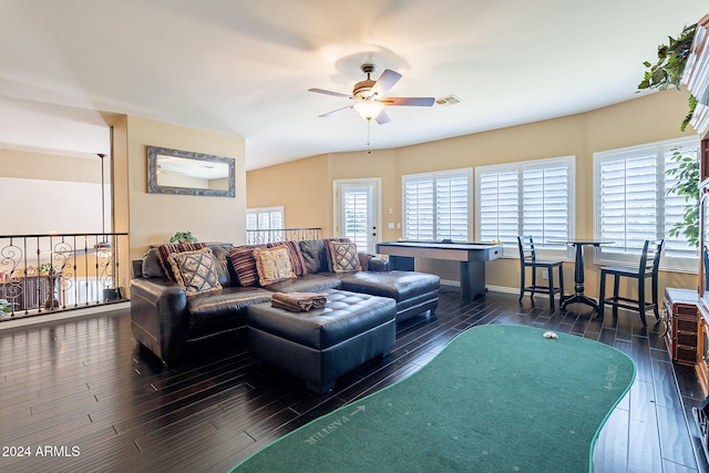 living room featuring ceiling fan and dark hardwood / wood-style floors