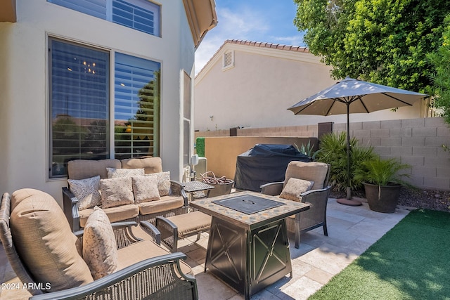 view of patio with grilling area and an outdoor living space