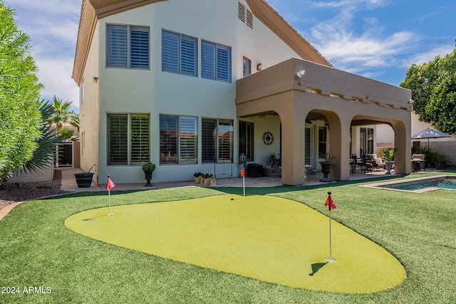 rear view of property with a patio area