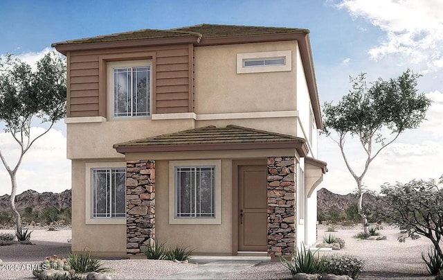 view of front facade with stone siding and stucco siding