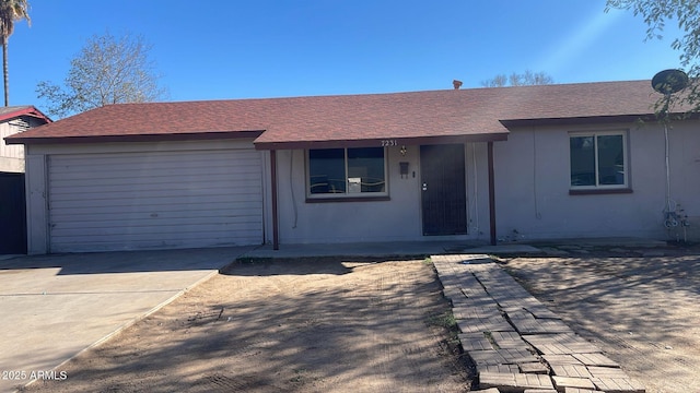 single story home featuring a garage