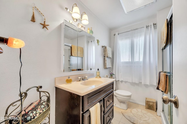 bathroom featuring toilet, tile patterned floors, and vanity