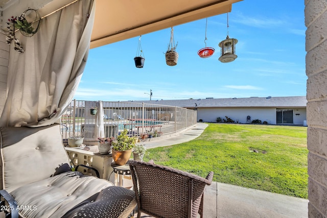 view of patio / terrace with a fenced in pool and fence