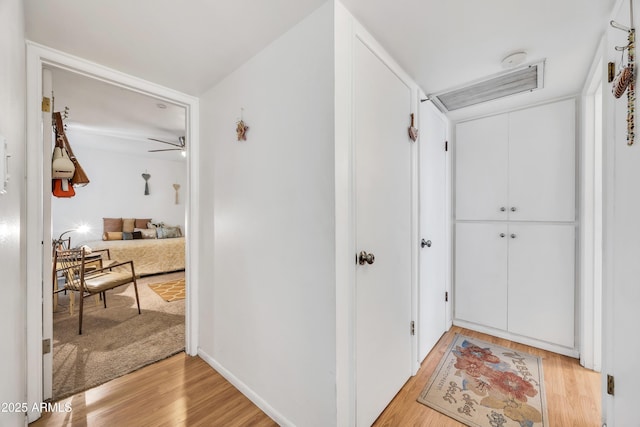 hall with light wood-type flooring