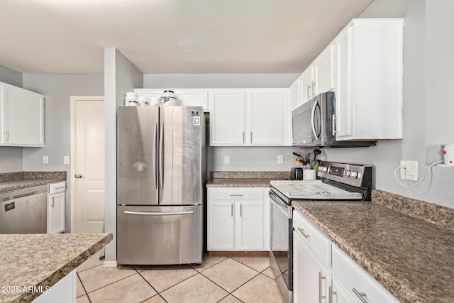 kitchen featuring white cabinetry, appliances with stainless steel finishes, and light tile patterned floors