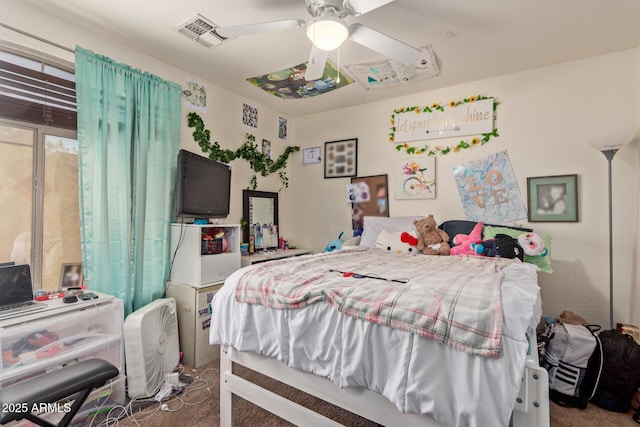 bedroom with ceiling fan and carpet