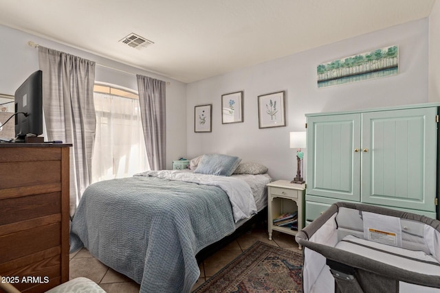 bedroom with light tile patterned flooring