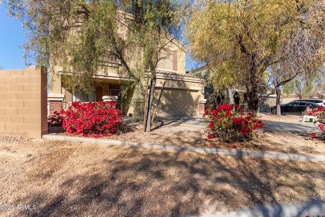 obstructed view of property featuring a garage