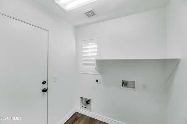 laundry area featuring electric dryer hookup, hookup for a washing machine, and dark hardwood / wood-style flooring