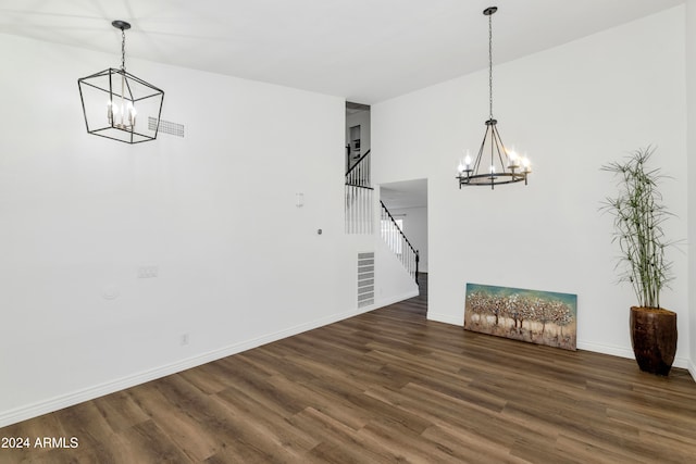 unfurnished living room featuring dark hardwood / wood-style flooring