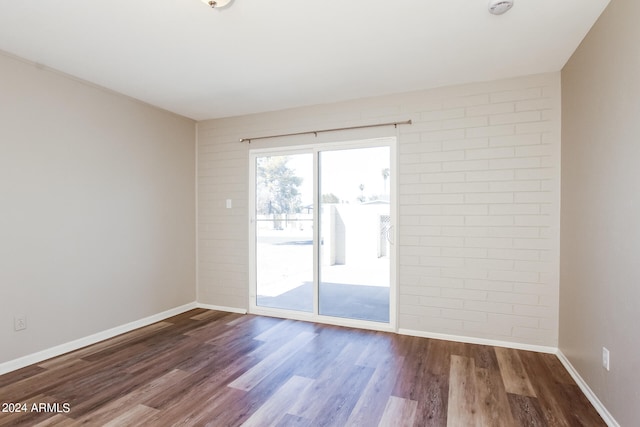 empty room featuring wood-type flooring