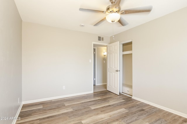 spare room featuring light hardwood / wood-style floors and ceiling fan