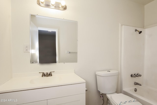 full bathroom with washtub / shower combination, vanity, and toilet