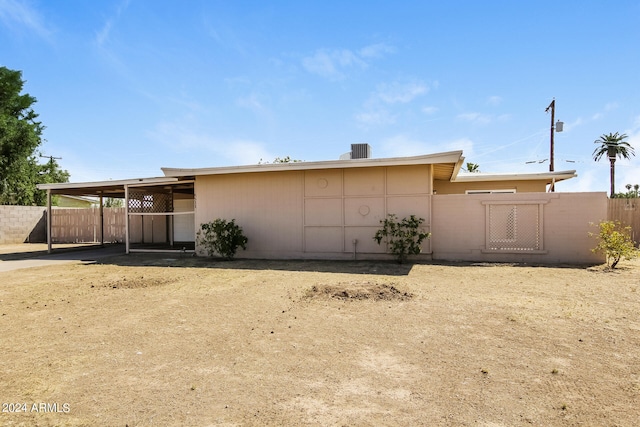 rear view of property with central air condition unit