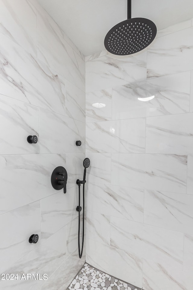 bathroom with tiled shower