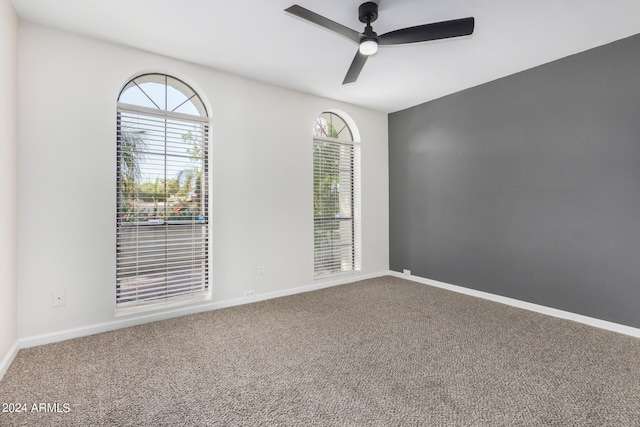 carpeted empty room with ceiling fan