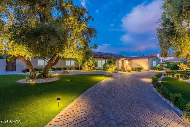 view of front of home featuring a lawn