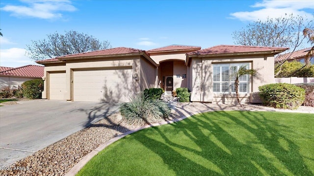 mediterranean / spanish-style home featuring a garage and a front lawn