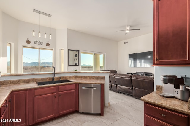 kitchen featuring decorative light fixtures, stainless steel dishwasher, plenty of natural light, and sink