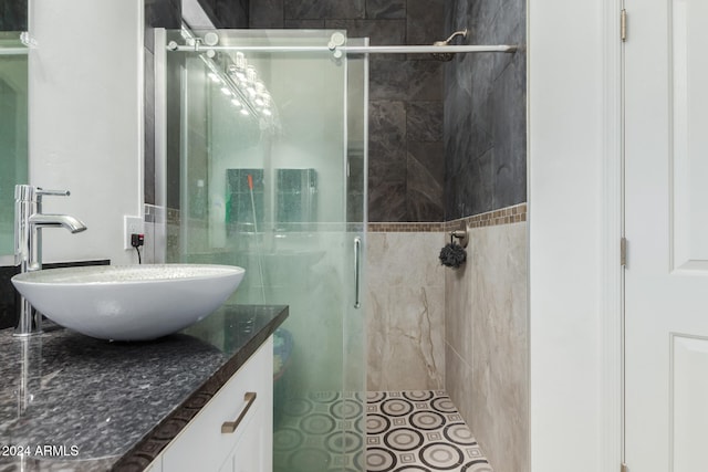 bathroom with vanity and an enclosed shower