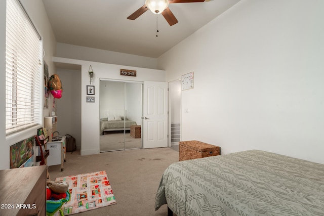 bedroom with carpet flooring, ceiling fan, and a closet