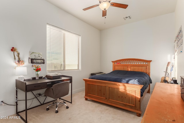 bedroom featuring ceiling fan and light carpet