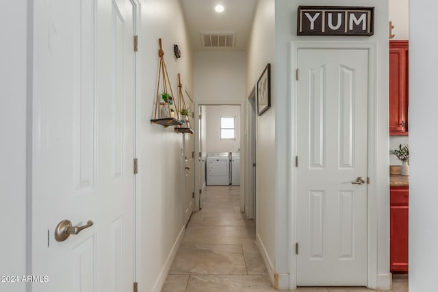 hallway with washer and dryer