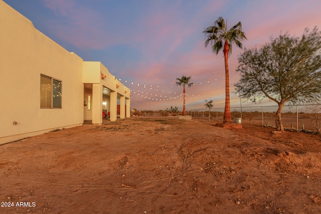 view of yard at dusk