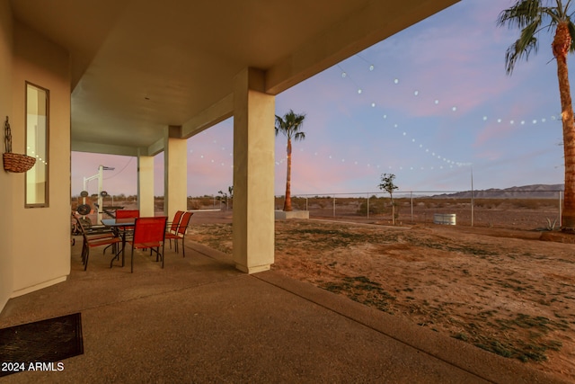 view of patio terrace at dusk