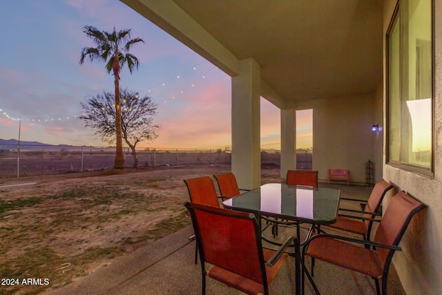 view of patio terrace at dusk