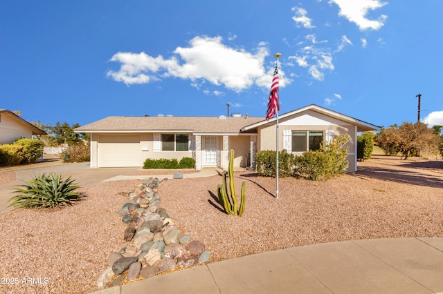 ranch-style home featuring a garage