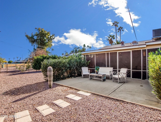 view of yard featuring a patio area and a sunroom