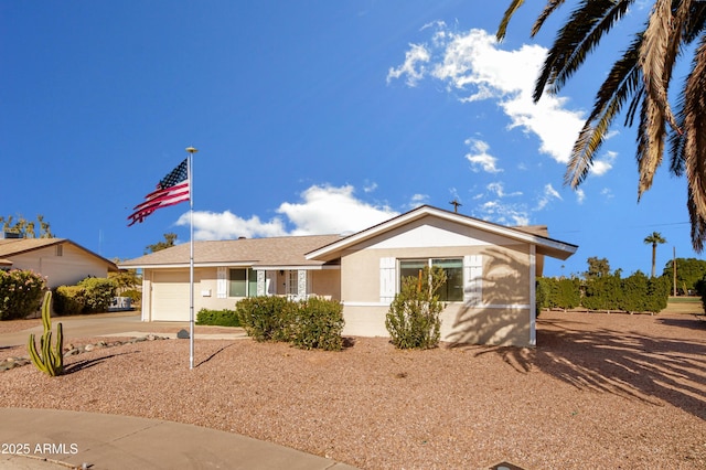 ranch-style home featuring a garage