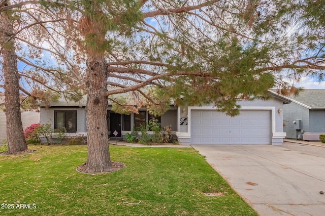 view of front of property featuring a garage and a front yard