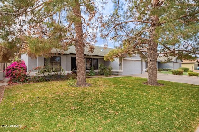 ranch-style house with a garage and a front yard