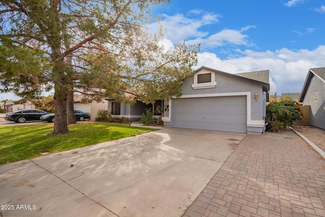 view of front facade with a garage and a front lawn